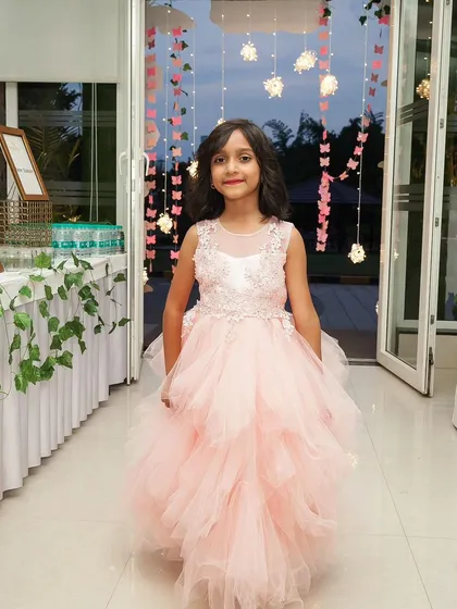 While I love candid shots, I also make sure to get beautiful portraits of the star of the show. This birthday girl is captured in her lovely dress, a classic photo that perfectly complements the action shots from her party.