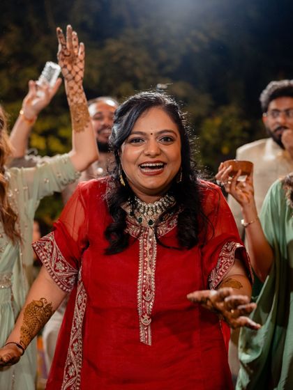 The bride dancing with joy, her relaxed-fit outfit allowing for complete freedom of movement.