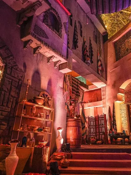 Another view of the multi-level Arabian marketplace set. The design incorporates different textures, architectural styles, and props to create a realistic and engaging environment.