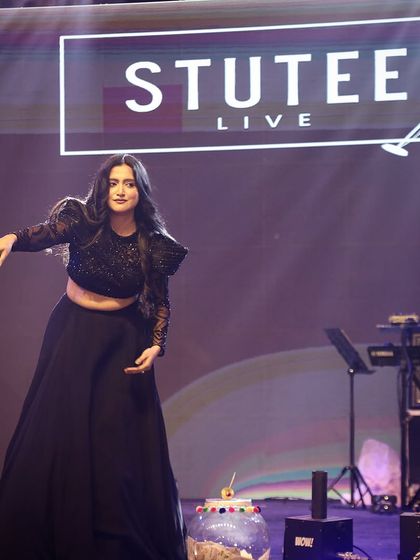 Here I am on stage at the Rotary Club event, with my keyboardist in the background. This shows a glimpse of my professional band setup, suitable for any corporate function.