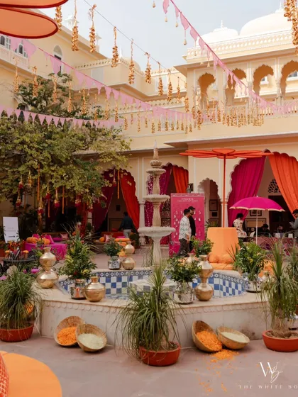 A vibrant Mehendi ceremony at Nahargarh Palace. The courtyard was filled with colorful drapes, traditional seating, and festive decor, creating a celebration that blended royal charm with cultural richness.