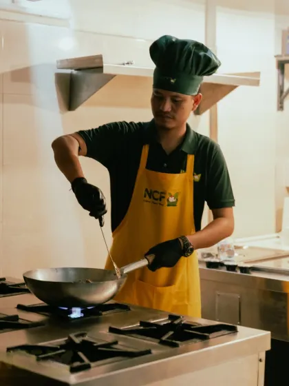 Here I am in my kitchen, preparing your meals with care. I believe in a hands-on approach, ensuring every dish has that authentic, home-cooked taste.