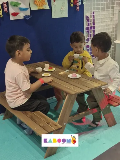 Tea party time! These friends are enjoying a pretend meal at our kid-sized picnic table.