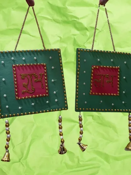 Another beautiful "Shubh Labh" hanging, this one in green and red with bells. Kids love making their own festive decor.