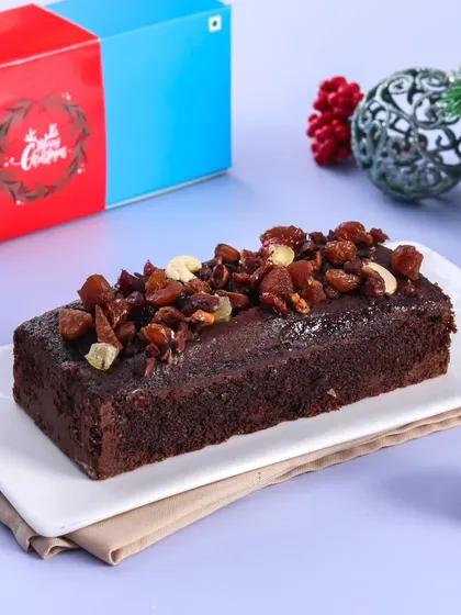 A closer look at our rich and moist Christmas plum cake, beautifully packaged and ready for gifting. It’s the taste of Christmas in every bite.