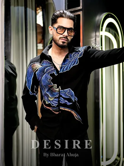 Commanding presence, bold design. This shirt fuses modern art with timeless elegance, featuring abstract, hand-painted waves of blue and purple.