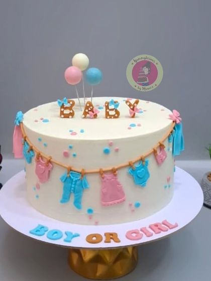 Another angle of the clothesline baby shower cake, a simple and sweet way to build excitement.