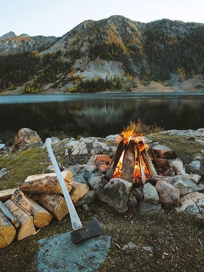 A classic lakeside campfire scene. I prepare the firewood and the fire pit, so all you need to do is settle in and enjoy the warmth against the cool air coming off the water. The mountain view across the lake makes it even more special.