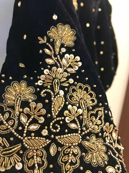 Another angle of the detailed hand embroidery on a black velvet fabric, perfect for a classic bridal or festive blouse.