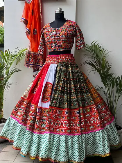 Another variation of the zig-zag border lehenga, this one with a patchwork-style skirt. The mix of colors and patterns is incredible.