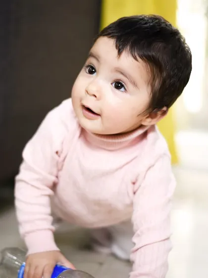 Capturing the milestone of crawling and exploring. Home sessions allow me to document these important moments as they naturally happen.