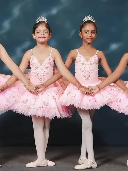 The magic of performance is the culmination of hard work and passion. These young ballerinas, dressed for their "Barbie x Swan Lake" piece, showcase the grace and poise they developed during their training. Our intensives prepare students for the stage, giving them a chance to shine.