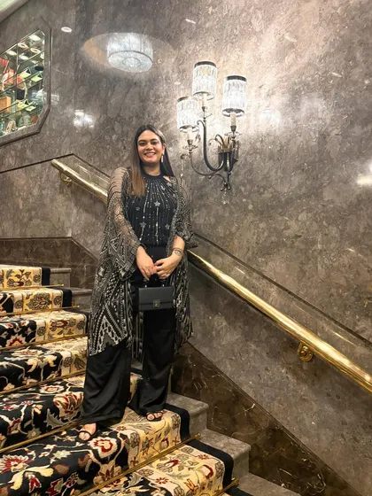 A classic Couture Week look. I layered a printed Ritu Kumar cape over an all black outfit for a day of shows. It's chic, comfortable, and showcases a legendary Indian designer.