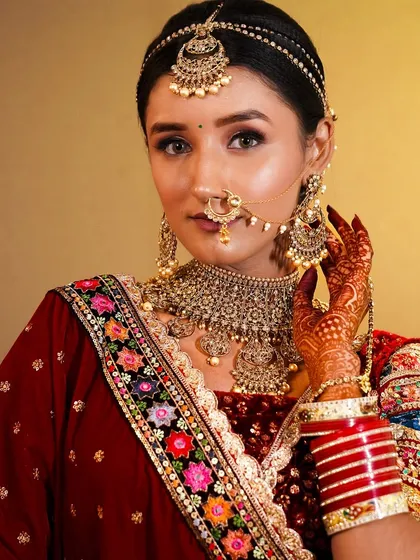 This is the kind of professional, high-quality photo my students create for their portfolio. A perfect traditional bridal makeup look that shows their skill.