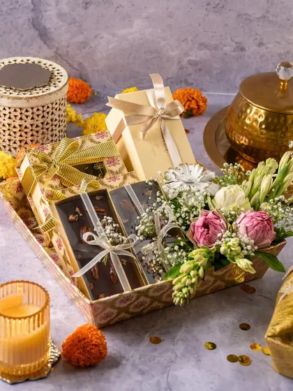 Another one of our custom Diwali trays, this one featuring our popular chocolate bark along with other treats and fresh flowers.