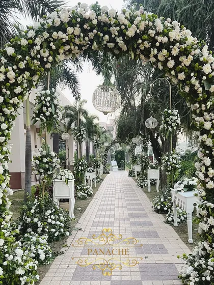 The grand floral archway that served as the entrance to the engagement ceremony, creating a beautiful welcome for guests.