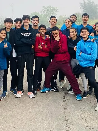 Teammate plus work equals success. A group photo of our athletes after a challenging outdoor running session.