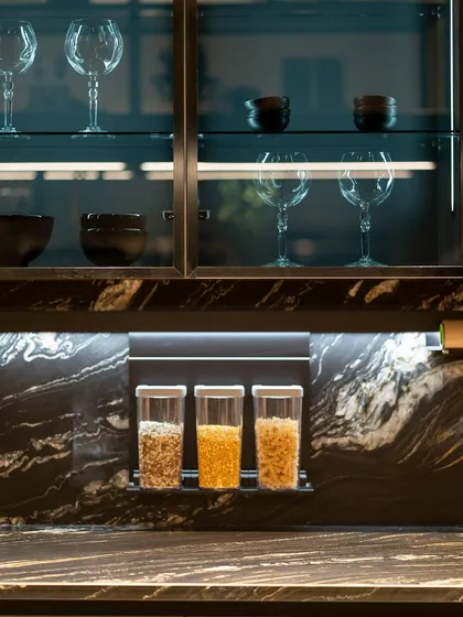 A close-up of our rail system for storage, keeping spices and essentials within easy reach while maintaining a clean countertop.