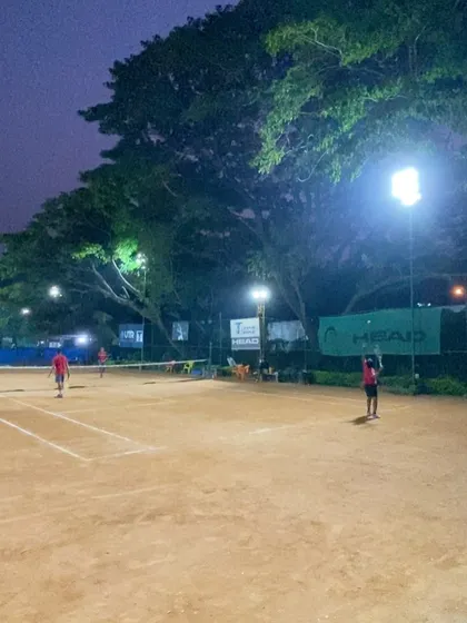 A glimpse of the action during a Tennis Temple Premier League match in December 2022. Our well-maintained clay courts come alive under the floodlights, providing the perfect setting for competitive tennis late into the evening.