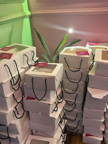 Stacks of birthday hampers and dessert cups, ready for a large party. I can handle bulk orders of any size with ease.