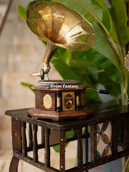 A close-up of a vintage gramophone prop used in a traditional decor setup. I enjoy sourcing unique props like this to add a touch of personality and charm to your event.