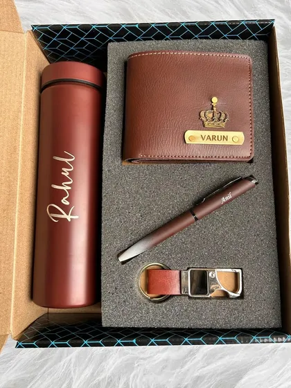 This 4-in-1 gift set is shown here in a rich brown color. It's a complete, personalized package containing a turbo bottle, wallet, pen, and keychain for a thoughtful and practical gift.