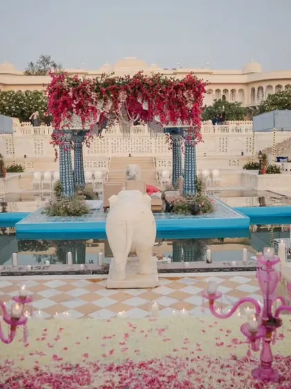 The grandeur of Nahargarh Palace provided a stunning canvas for this regal wedding setup. We used fuchsia bougainvillea, majestic blue pillars, and floating candles to transform the space into a magical oasis, blending royal Rajasthani heritage with our bespoke design.