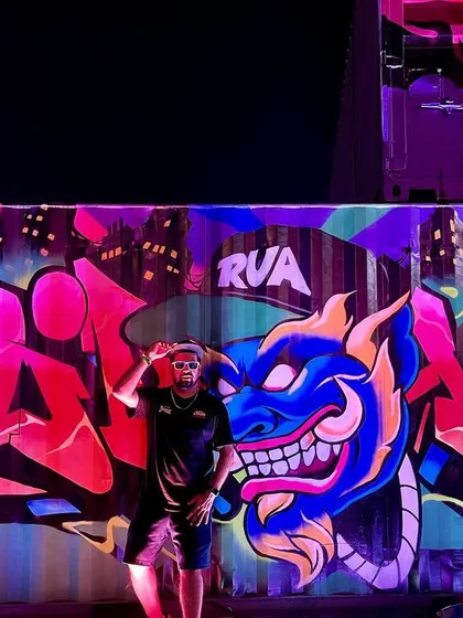 A full-length shot of me in front of the massive graffiti mural.