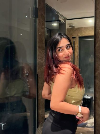 A playful pose in the corset, showing my personality. This makes the brand collaboration feel more authentic and less like a typical ad.