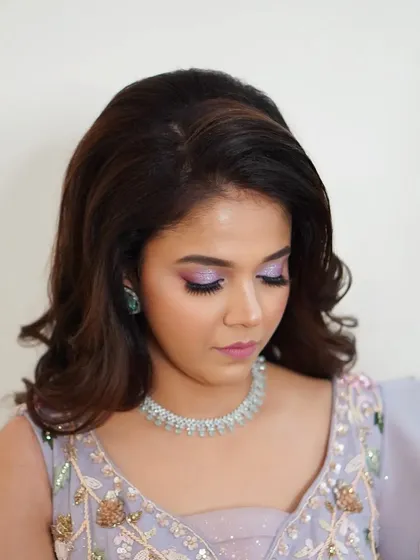 Another angle of Nilofar's enchanting engagement makeup. The shimmering lilac eyeshadow is the star, creating a look that is modern, romantic, and utterly unique.