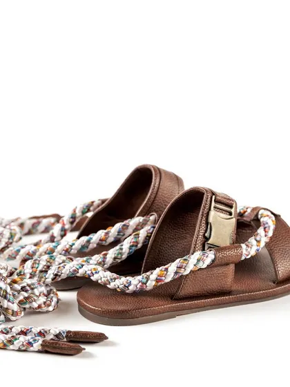 A shot showing the full length of the rope ties on the Jeetinder Sandhu sandals, emphasizing their unique wrap-around design feature.
