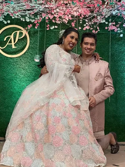 A sweet moment with the newly engaged couple. The groom on his knee is a classic romantic gesture that we can even incorporate into the choreography.