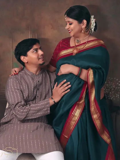 A loving portrait of the couple, their gazes locked. The traditional attire and artistic lighting give it a timeless quality.