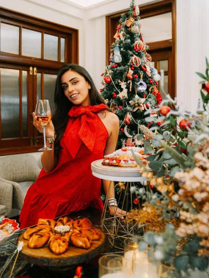 Getting into the holiday spirit with a glass of wine and a table full of my Christmas creations.
