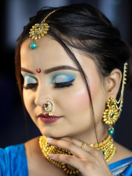 Another angle of the Bengali look, focusing on the eye makeup and the traditional nose ring.
