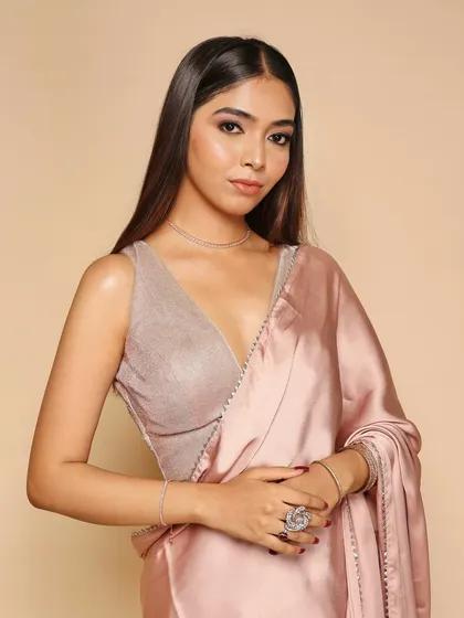 A detailed shot focusing on the blouse, jewelry, and makeup, showing the versatility of the studio for beauty and fashion.