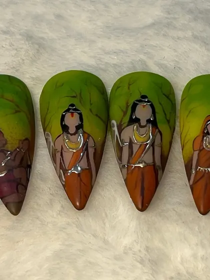 "Ram Aayenge." This nail art set was created to celebrate the inauguration of the Ram Mandir in Ayodhya, depicting Ram, Sita, Lakshman, and Hanuman.