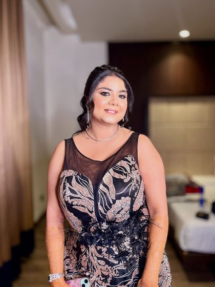 Another view of this glamorous cocktail look. The soft smokey eyes and glowing skin are perfect for an evening of celebration.