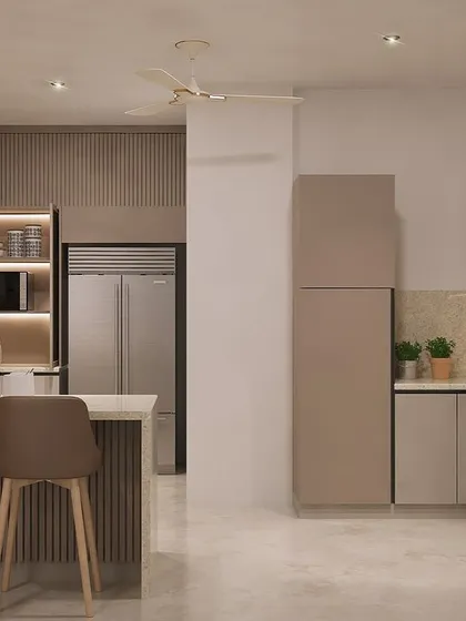 This wider angle shows how the kitchen connects to the rest of the living space. The design uses a consistent color palette and under-cabinet LED lighting to ensure the kitchen feels both functional and cozy.
