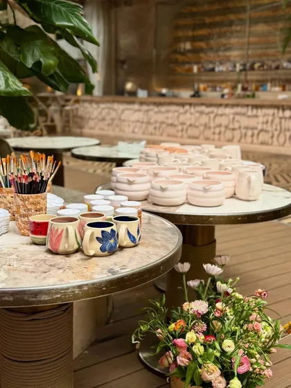 We also host private events, like this dreamy ceramic painting evening at Bastian Garden City, with tables set up for guests to paint their own mugs.
