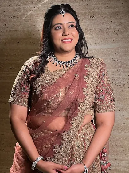 A happy bride, looking radiant and elegant for her engagement party.