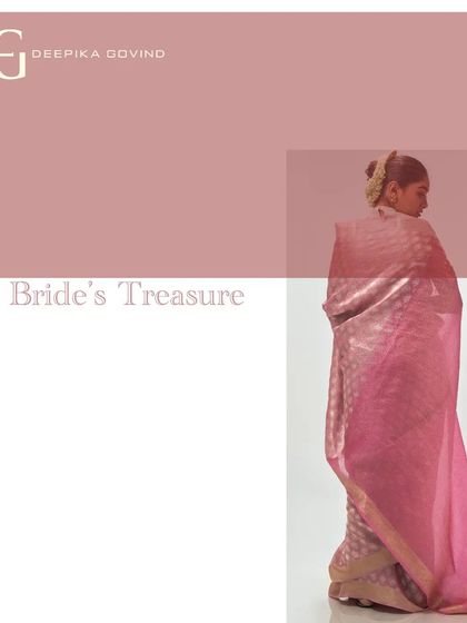 A back view capturing the full beauty of the 'Madder Rose' pallu against the softer rose-toned body.