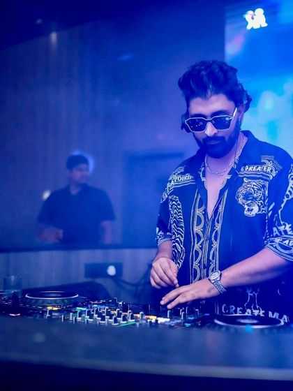 A focused shot in the blue light of the club.