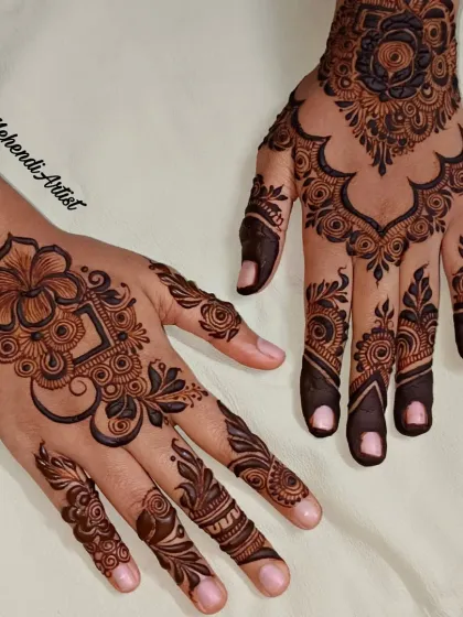 A different angle of the bold party henna, showing how the design flows on the hands.