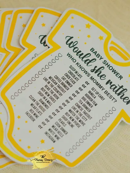 These 'Who Knows Mommy Best?' game cards, shaped like adorable baby onesies, are a wonderful way for guests to interact and share a laugh. It's a sweet and personal touch that everyone enjoys.