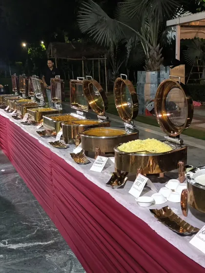 Another angle of our extensive dinner buffet for an outdoor party. We ensure there is a generous spread with multiple options to cater to different tastes and dietary preferences.