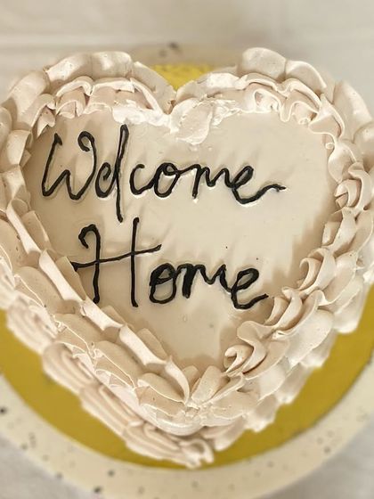 The top view of our beautiful heart-shaped cake, a sweet way to greet a loved one.