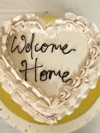The top view of our beautiful heart-shaped cake, a sweet way to greet a loved one.