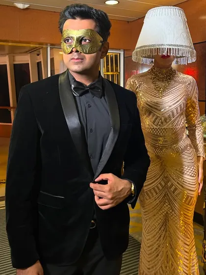Ready for a moonlight masquerade. The mask adds a layer of mystery, which is the perfect accessory for an evening of illusion and mentalism.