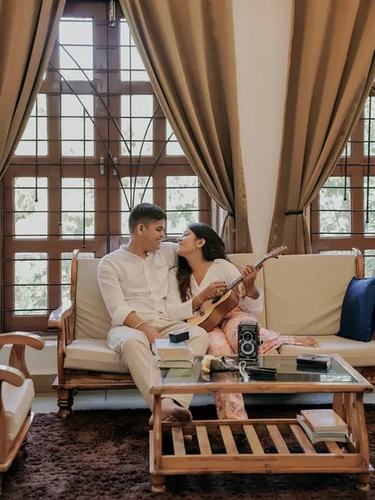 Love is often found in the quiet, everyday moments. A cozy corner, a shared song on a ukulele, and a comfortable silence that says everything. I capture love stories everywhere, from grand palaces to the warmth of your home.
